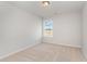 Cozy bedroom featuring neutral carpet, a window with natural light, and a fresh, minimalist design at 1013 Woodside Dr., Conway, SC 29526
