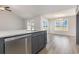 Stylish kitchen island with granite countertop, stainless dishwasher, and seating area at 1013 Woodside Dr., Conway, SC 29526