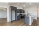 Well-equipped kitchen boasts stainless appliances, granite counters, and sleek gray cabinets at 1013 Woodside Dr., Conway, SC 29526