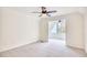 Bright bedroom with neutral carpet, ceiling fan, and a view of an arched window at 1023 S Sea Bridge Ct., Surfside Beach, SC 29575
