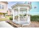 Charming gazebo with a picnic table, surrounded by lush landscaping at 1023 S Sea Bridge Ct., Surfside Beach, SC 29575