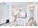 Open kitchen with white cabinets, stainless appliances, and breakfast bar with seating at 1023 S Sea Bridge Ct., Surfside Beach, SC 29575