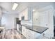 Bright kitchen with white cabinets, granite countertops, stainless steel appliances, and modern fixtures at 1023 S Sea Bridge Ct., Surfside Beach, SC 29575
