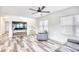 Cozy living room with stairs, entertainment center and comfortable seating area at 1023 S Sea Bridge Ct., Surfside Beach, SC 29575