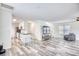 Open-concept living space featuring wood-look flooring, a kitchen, and seating at 1023 S Sea Bridge Ct., Surfside Beach, SC 29575