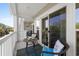Inviting balcony featuring cozy seating, a small table, and sliding glass door access to the living area at 1025 World Tour Blvd. # 301, Myrtle Beach, SC 29579