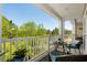 Scenic balcony view with comfortable seating and white railing overlooking a beautiful green space at 1025 World Tour Blvd. # 301, Myrtle Beach, SC 29579