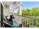 Inviting balcony with comfortable wicker seating, offering a serene outdoor retreat and views of lush greenery at 1025 World Tour Blvd. # 301, Myrtle Beach, SC 29579