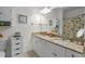 Well-lit bathroom with double sinks, granite countertop, and framed mirrors at 1025 World Tour Blvd. # 301, Myrtle Beach, SC 29579