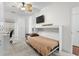Bright bedroom with Murphy bed, neutral decor, closet, ceiling fan, and window to provide plenty of natural light at 1025 World Tour Blvd. # 301, Myrtle Beach, SC 29579
