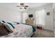 Bright bedroom with two beds, neutral decor, closet, ceiling fan, and window to provide plenty of natural light at 1025 World Tour Blvd. # 301, Myrtle Beach, SC 29579