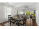 Comfortable dining area flowing into the living room, featuring vaulted ceilings and lots of natural light at 1025 World Tour Blvd. # 301, Myrtle Beach, SC 29579