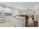 Modern, open-concept kitchen featuring stainless appliances, a breakfast bar, and seamless flow to living spaces at 1025 World Tour Blvd. # 301, Myrtle Beach, SC 29579