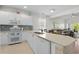 Bright kitchen featuring white cabinets, modern appliances, and an open concept design to the living area at 1025 World Tour Blvd. # 301, Myrtle Beach, SC 29579