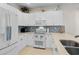 Well-lit kitchen featuring white cabinets, modern appliances, and light countertops at 1025 World Tour Blvd. # 301, Myrtle Beach, SC 29579