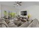 Cozy living room showcasing vaulted ceilings and a seamless transition to the outdoor balcony at 1025 World Tour Blvd. # 301, Myrtle Beach, SC 29579
