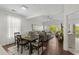 Open-concept living and dining area with hardwood floors, high ceilings, and natural light at 1025 World Tour Blvd. # 301, Myrtle Beach, SC 29579
