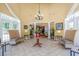 Bright and inviting lobby features tile floors, comfortable seating, and elegant chandelier at 1025 World Tour Blvd. # 301, Myrtle Beach, SC 29579