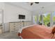 Spacious main bedroom with light-colored furniture and private access to the outdoor balcony at 1025 World Tour Blvd. # 301, Myrtle Beach, SC 29579