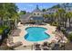 Inviting community pool surrounded by lounge chairs and lush landscaping, perfect for relaxation and recreation at 1025 World Tour Blvd. # 301, Myrtle Beach, SC 29579