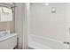 Cozy bathroom featuring a shower with a curtain and a towel rack stocked with plush, white towels at 1105 South Ocean Blvd. # 1008, Myrtle Beach, SC 29577