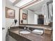 Bathroom vanity featuring granite counters, framed mirror, and updated fixtures at 1105 South Ocean Blvd. # 1008, Myrtle Beach, SC 29577