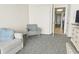 Bedroom featuring a seating area with comfortable armchair and a clear view to hallway at 1105 South Ocean Blvd. # 1008, Myrtle Beach, SC 29577