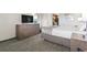 Bedroom with queen bed, dresser with flat screen TV, and neutral carpet and bedding at 1105 South Ocean Blvd. # 1008, Myrtle Beach, SC 29577