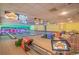 Bowling alley with multiple lanes, comfortable seating, and TV screens at 1105 South Ocean Blvd. # 1008, Myrtle Beach, SC 29577
