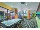 Spacious game room featuring an air hockey table, multiple arcade games and a relaxing sitting area at 1105 South Ocean Blvd. # 1008, Myrtle Beach, SC 29577