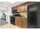 Efficiency kitchen featuring cabinets, microwave, oven, and open access to the unit at 1105 South Ocean Blvd. # 1008, Myrtle Beach, SC 29577