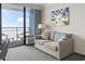 Cozy living room with balcony access and comfortable seating, offering stunning views at 1105 South Ocean Blvd. # 1008, Myrtle Beach, SC 29577