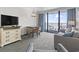 Living space featuring a table, seating, TV, and balcony overlooking the ocean at 1105 South Ocean Blvd. # 1008, Myrtle Beach, SC 29577