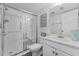 Modern bathroom with glass-enclosed shower, vanity, and neutral decor at 1108 N Waccamaw Dr. # C-4, Garden City Beach, SC 29576