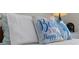 Comfortable bedroom decorated with charming beach-themed pillows at 1108 N Waccamaw Dr. # C-4, Garden City Beach, SC 29576