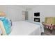 Comfortable bedroom features a fireplace, TV, and access to ensuite bathroom at 1108 N Waccamaw Dr. # C-4, Garden City Beach, SC 29576