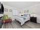 Bright bedroom with decorative pillows, chair and bedside tables with lamps at 1108 N Waccamaw Dr. # C-4, Garden City Beach, SC 29576