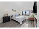 Cozy bedroom with ocean view, comfortable bed, and inviting decor at 1108 N Waccamaw Dr. # C-4, Garden City Beach, SC 29576