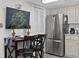 Cozy kitchen featuring stainless steel appliances, light cabinets, and a dining area at 1108 N Waccamaw Dr. # C-4, Garden City Beach, SC 29576
