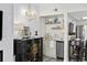 Charming kitchenette featuring unique decorations, a mini fridge, and an adjoining eating area at 1108 N Waccamaw Dr. # C-4, Garden City Beach, SC 29576