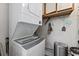 Laundry room with stacked washer and dryer unit and storage space at 1108 N Waccamaw Dr. # C-4, Garden City Beach, SC 29576