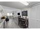 Bright living room with a fireplace, dining area, and modern decor at 1108 N Waccamaw Dr. # C-4, Garden City Beach, SC 29576