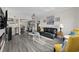 Open concept living room with modern decor, leading to a kitchen at 1108 N Waccamaw Dr. # C-4, Garden City Beach, SC 29576