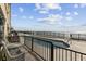 Outdoor pool with beach views from a condo balcony with seating at 1108 N Waccamaw Dr. # C-4, Garden City Beach, SC 29576