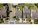 Aerial view of homes showcasing the neighborhood layout, streetscape, and surrounding trees at 1129 Prescott Circle, Myrtle Beach, SC 29577