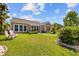 A serene backyard offering well-maintained lawn and landscaping to create an inviting outdoor living space at 1129 Prescott Circle, Myrtle Beach, SC 29577