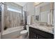 Bathroom with a granite countertop, tiled shower and tub featuring modern fixtures at 1129 Prescott Circle, Myrtle Beach, SC 29577