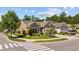 Beautiful single-story home on a corner lot with lush landscaping, and an attached two-car garage at 1129 Prescott Circle, Myrtle Beach, SC 29577