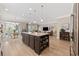 Bright, open kitchen with an island that provides seating, seamlessly blending with dining and living areas at 1129 Prescott Circle, Myrtle Beach, SC 29577