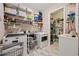Well-organized laundry room with ample storage, shelving, and a convenient utility sink at 1129 Prescott Circle, Myrtle Beach, SC 29577